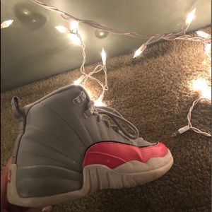 womans athletic pink & grey Air Jordan 12 Retro’s